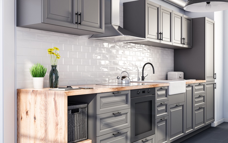 Beautifully painted gray kitchen cabinets, classic and unbeatable - services provided by Painter1