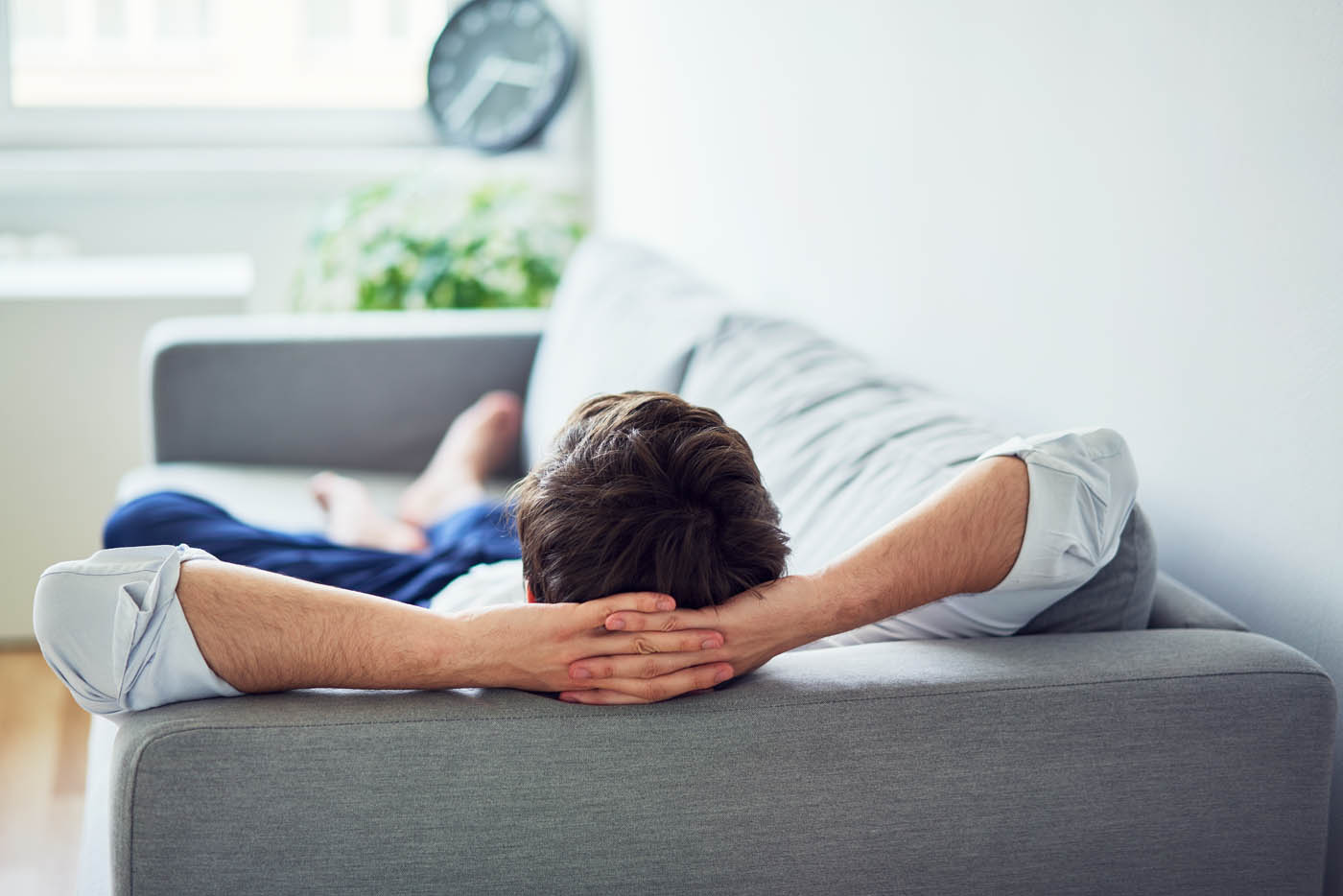 A man relaxing in his home, knowing termites are no longer a threat to his property - find this same peace of mind with Rest Easy Pest Control, the best termite company.